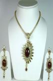 Maroon and Golden Color Stone Studded Pendant Set